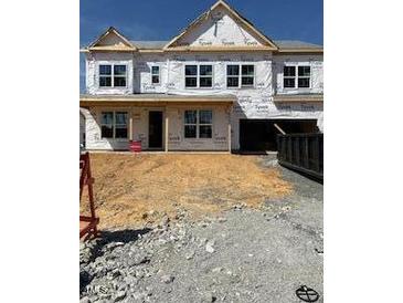 Construction site of a two-story home with visible framing and construction materials at 1216 Opal Ln # 90, Durham, NC 27705