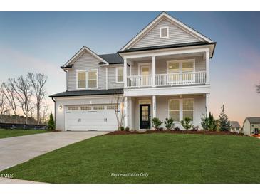 Stunning two-story home with a spacious front yard, covered porch and a two-car garage at 1783 Ballard Rd # Apex Georgian, Fuquay Varina, NC 27526