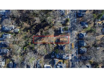 Aerial view of property highlighting its generous lot size, mature trees, and location within a residential area at 306 N Driver St, Durham, NC 27703
