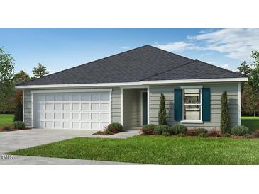 Charming single-story home featuring a well-maintained lawn and a two-car garage at 48 Longdale Dr, Graham, NC 27253