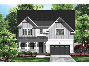 Charming two-story home with a mix of white and gray vertical siding at 122 Sanderway Dr, Chapel Hill, NC 27516
