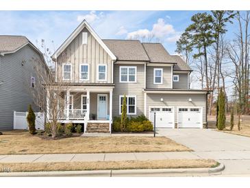 Charming two-story home with a welcoming front porch and attached two-car garage at 428 Boulder Point Dr, Chapel Hill, NC 27516