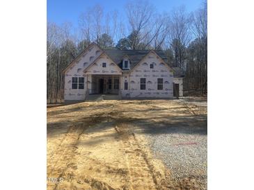 New construction home featuring a covered entry and a gabled roof design at 60 Valebrook Ct, Youngsville, NC 27596