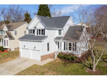 Charming two-story home with a two-car garage and manicured lawn at 1204 Matthews Glen Dr, Knightdale, NC 27545