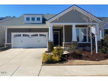 Charming home with a two-car garage, well-maintained lawn, and neutral-colored exterior at 1216 Blue Mist Ct, Apex, NC 27502