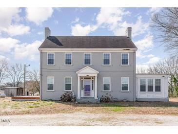 Charming two-story home featuring a symmetrical facade and a welcoming entrance at 2110 Cokey Rd, Rocky Mount, NC 27801