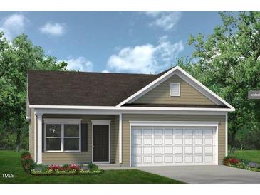 Charming one-story home with a well-manicured lawn and an attached two-car garage at 242 Deodora Ln, Cameron, NC 28326
