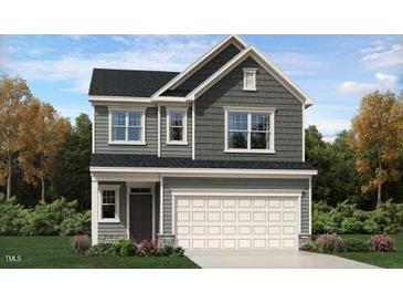 Charming two-story home with a two-car garage and classic design elements at 10044 Regal Dr, Angier, NC 27501