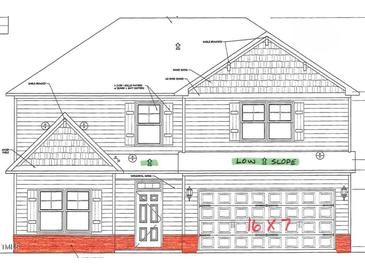 Charming two-story home with horizontal siding, board & batt shutters, shake siding, gable brackets and a low slope at 630 Husketh Rd, Youngsville, NC 27596
