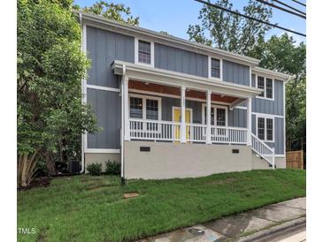 Charming two-story home with a welcoming front porch, grey siding, and white trim, set on a well-maintained lawn at 1521 Chapel Hill Rd, Durham, NC 27701