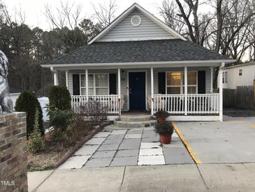 Charming single-story home with a welcoming front porch and meticulously landscaped yard at 312 East End Ave, Durham, NC 27703