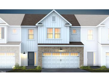 Charming two-story home with brick-accented facade and inviting attached two-car garage at 269 Broomside Ave, Raleigh, NC 27603