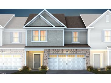 Charming new construction home with light grey brick accents and a two-car garage at 281 Broomside Ave, Raleigh, NC 27603