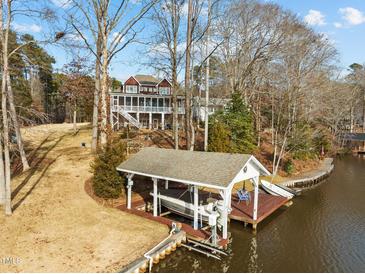 Waterfront home with a private boat dock and lift for easy lake access and enjoyment of waterfront living at 1315 Sagamore Dr, Louisburg, NC 27549
