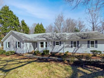 Charming single-story home featuring a well-maintained front yard and classic architectural details at 204 Lopez Ln, Clayton, NC 27527