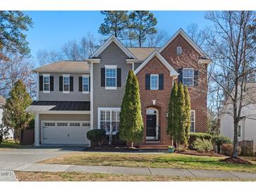 Charming home featuring a combination of brick and gray siding at 4711 Marena Pl, Durham, NC 27707