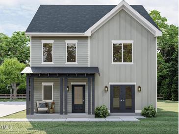 Charming two-story home featuring a covered porch and modern architectural design at 509 Colleton Rd, Raleigh, NC 27610