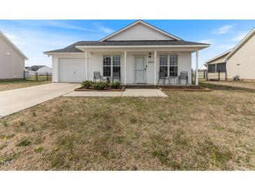 Charming single-story home with white siding, front porch, and well-maintained lawn at 2425 Shreve Rd, Rocky Mount, NC 27801