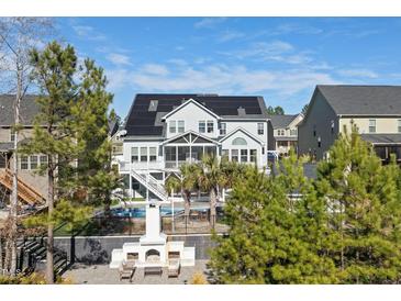 A spacious two-story home featuring a beautiful backyard pool, a fireplace and solar panels on the roof at 3633 Jordan Shires Dr, New Hill, NC 27562