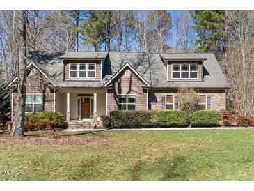 Charming home with a well-manicured lawn, beautiful landscaping, and classic architectural details at 3659 Brooks Bnd, Franklinton, NC 27525