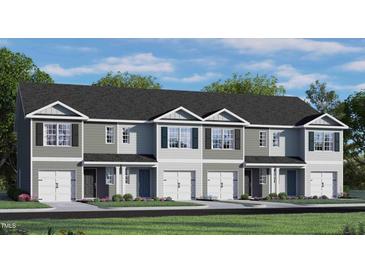 Charming townhome exterior with gray siding, white trim, dark shutters and a one-car garage at 416 Belgian Red Way, Wake Forest, NC 27587