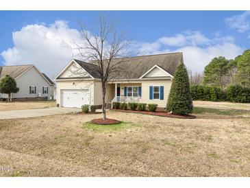 Charming single-Gathering home with a two-car garage and well-maintained landscaping at 55 Oak Leaf Dr, Lillington, NC 27546