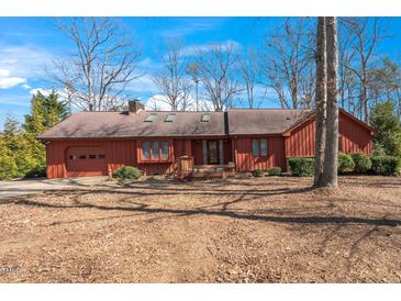 Charming single-Gathering home featuring an attached garage and well-maintained landscaping at 6312 New Market Way, Raleigh, NC 27615