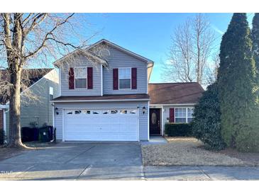 Charming two-story home featuring red shutters and a two-car garage at 4002 Rothfield Ln, Raleigh, NC 27616