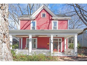 Charming two-story home with a cozy front porch and classic architectural details at 516 N Bloodworth St, Raleigh, NC 27604