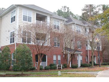 Attractive condominium complex with brick facade, neutral siding and well-maintained landscaping at 622 Ives Ct # 622, Chapel Hill, NC 27514