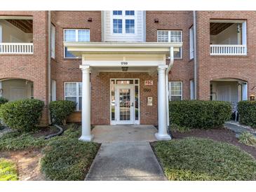 Brick building with white door and columns in front of entrance 1700 at 1700 Tiffany Bay Ct # 303, Raleigh, NC 27609