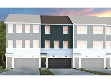 Townhome exterior featuring three units, garages, and hardiplank siding in a modern design at 1408 Chrysalis Pl, Apex, NC 27502
