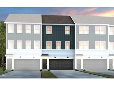 Charming new townhomes with a modern design featuring unique colors and attached garages at 1416 Chrysalis Pl, Apex, NC 27502
