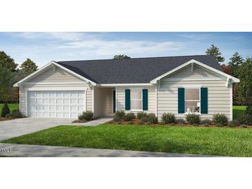 Charming single-story home with a two-car garage, light beige siding, and well-manicured front lawn at 158 Gobbler Dr, Smithfield, NC 27577