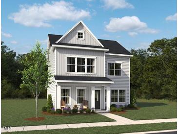Charming two-story home with a landscaped front yard and welcoming front porch at 265 Marvel Dr # 137, Rolesville, NC 27571
