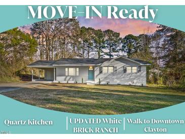 Charming single-story home with well-manicured lawn, carport, and mature trees at 109 Hardee St, Clayton, NC 27520