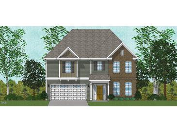 Charming two-story home featuring mixed siding and brick exterior with a two-car garage and a welcoming front porch at 2102 Channel St, Graham, NC 27253