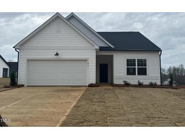 Charming single-Gathering home with a garage and freshly installed sod in the front yard at 11844 Ayshire Dr, Middlesex, NC 27557