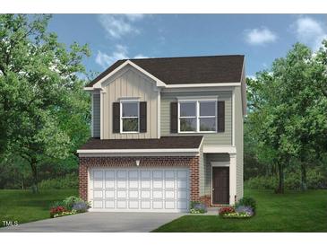 Charming two-story home with a brick-accented garage and well-maintained lawn, nestled among mature trees at 192 Bruce Dr, Dunn, NC 28334