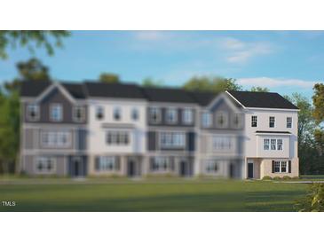 New townhouse with a manicured lawn and craftsman details, offering modern living at 609 Dorset Stream Dr, Fuquay Varina, NC 27526