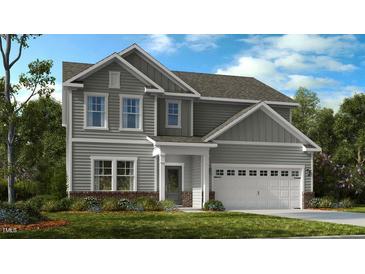 Charming two-story home with gray siding, white trim, and a well-manicured front lawn at 631 Contento Ct, Sanford, NC 27330