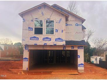 Two-story home under construction features a spacious two-car garage and a modern design at 110 W Kitchin St, Burlington, NC 27215