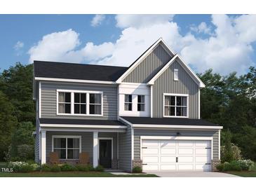 Charming two-story home features a gray exterior, covered porch, and an attached two-car garage at 117 N Stonemill Trl # Homesite 290, Clayton, NC 27520