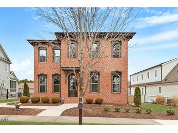 Charming brick two-story home with well-manicured landscaping and a classic facade at 1354 Briar Chapel Pkwy, Chapel Hill, NC 27516