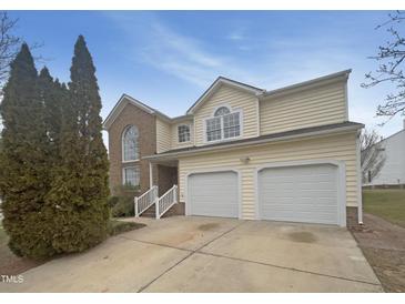 Charming two-story home with a brick accent and a two-car garage at 4 Birkdale Ct, Durham, NC 27713