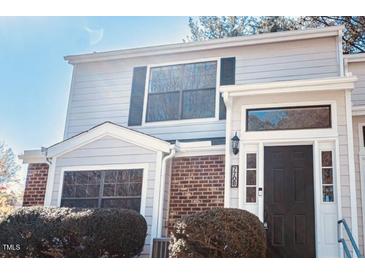 Charming two-story home with brick accents and well-maintained landscaping at 7708 Falcon Rest Cir, Raleigh, NC 27615