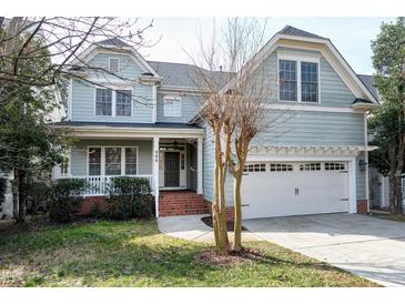 Charming two-story home with a welcoming front porch and a well-maintained lawn, perfect for curb appeal at 500 Chandler Grant Dr, Cary, NC 27519