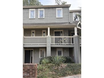Charming two-story condo features balconies, neutral paint, and well-maintained landscaping at 704 Martin Luther King Jr Blvd # D12, Chapel Hill, NC 27514