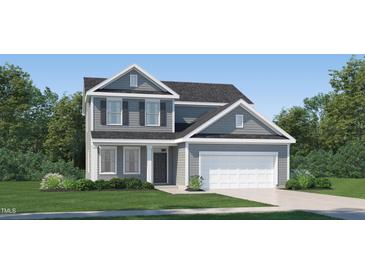 Charming two-story home with gray siding, a black roof, and a two-car garage at 4020 Shadbush St, Raleigh, NC 27616