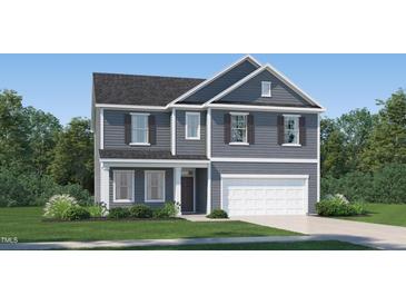 Charming two-story home with gray siding, shutters, and a manicured front yard at 4101 Shadbush St, Raleigh, NC 27616